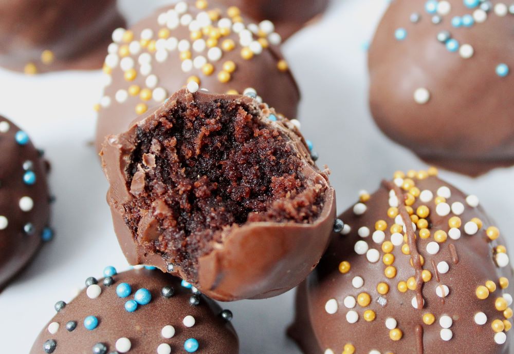 closeup of bitten brownie cheesecake truffle 1