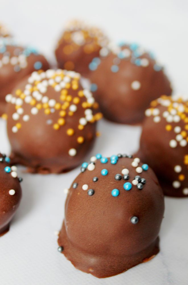 closeup of brownie cheesecake truffles with sprinkles 1