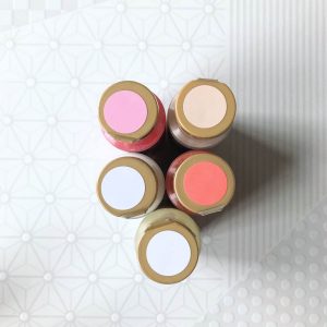 salmon pink cream and white acrylic paint supplies