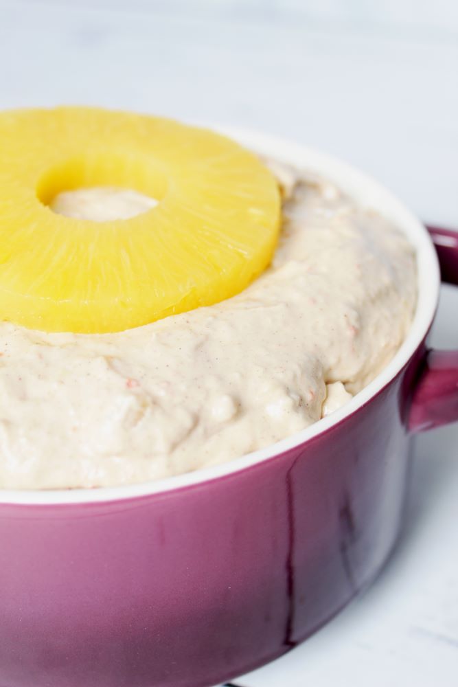 half view vertical of carrot cake dip with pineapple on top 1