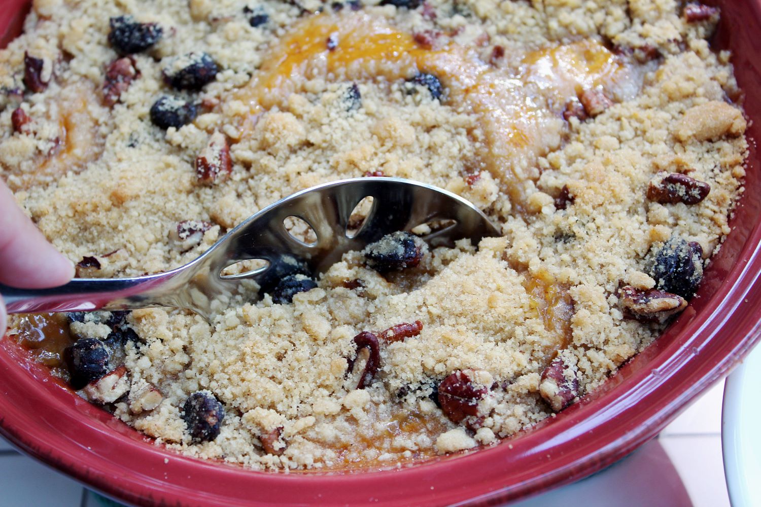 closeup spoon in cranberry pumpkin crumble 1