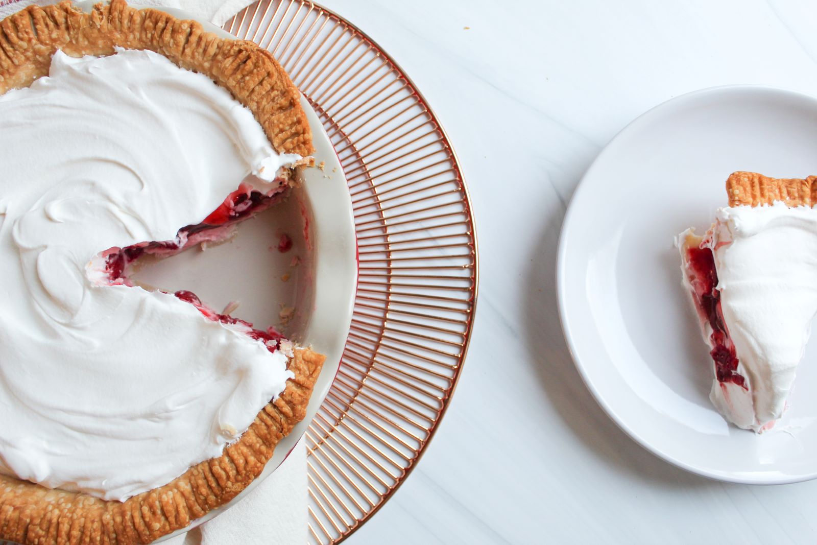cherry cream pie on gold plate with plated slice 1