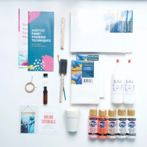 flatlay of acrylic paint pouring craft kit
