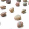 close up of finished painted rock domino set