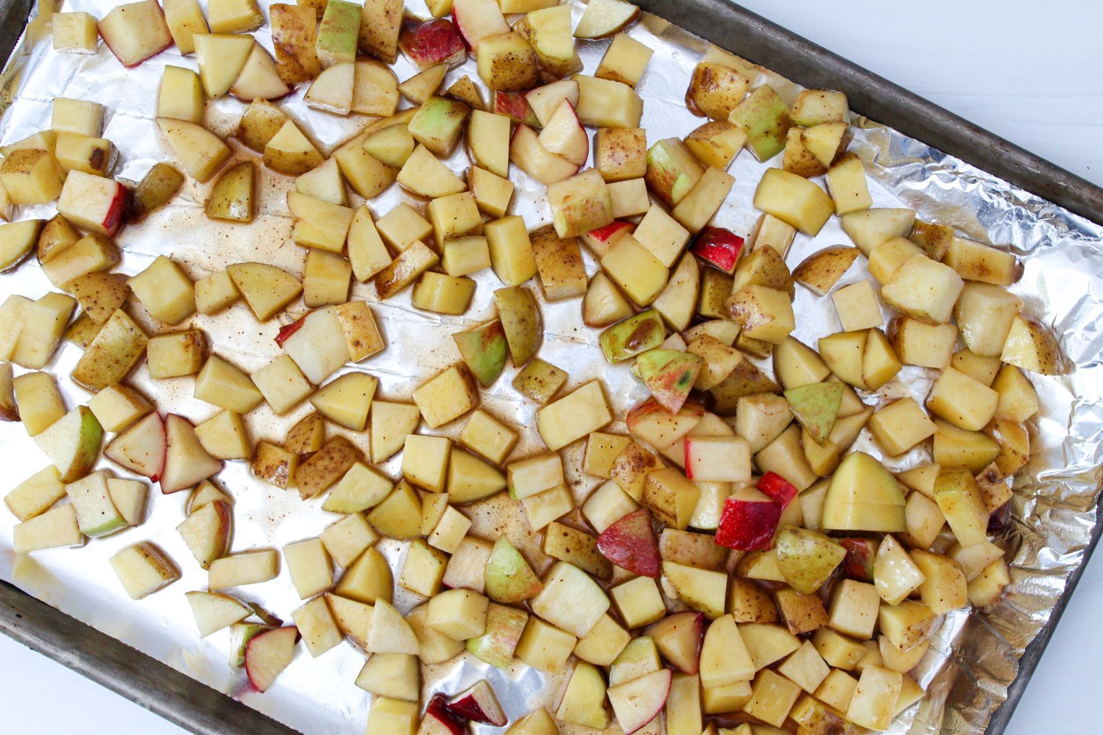 honey chipotle potatoes and apples on baking sheet 1