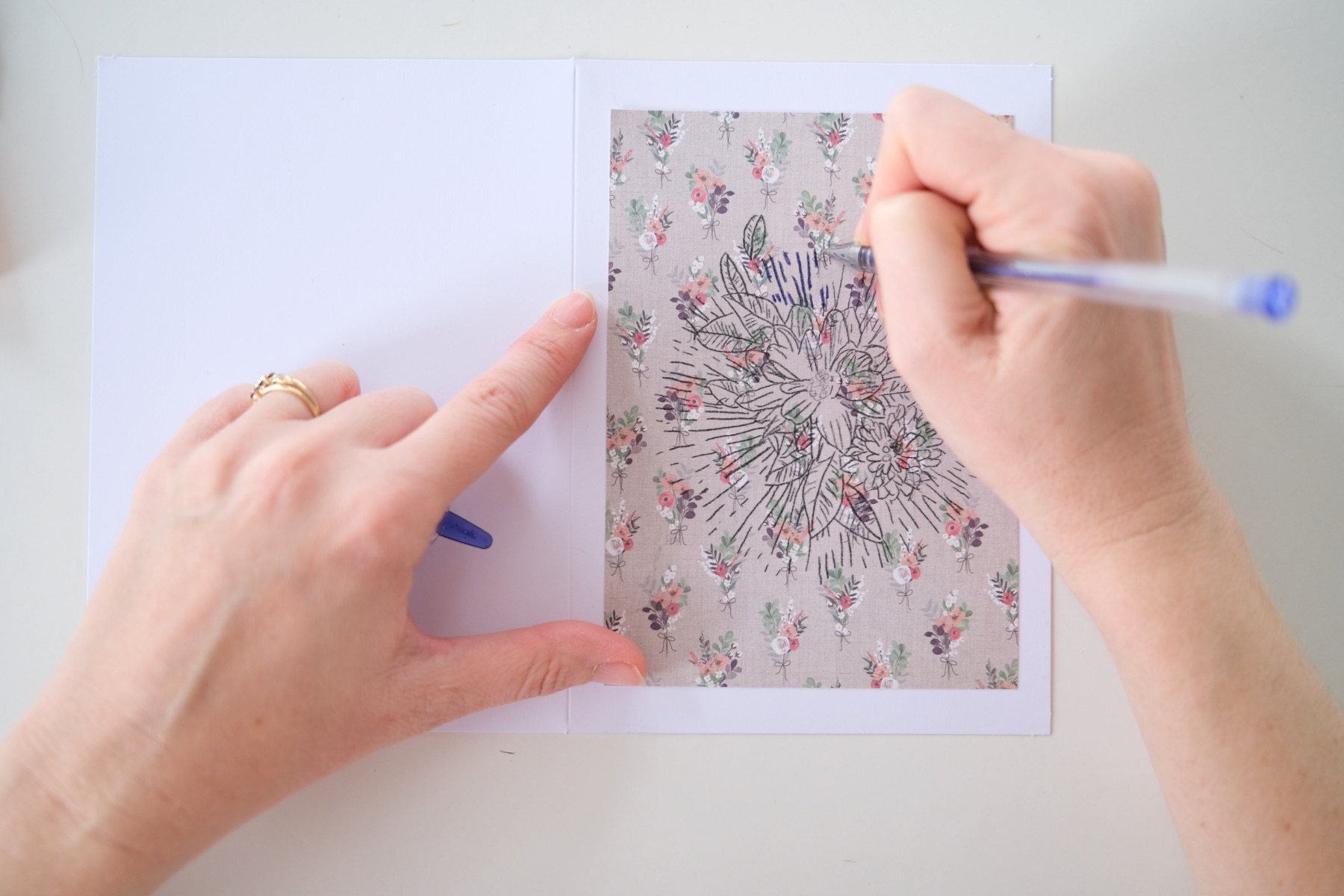use pen and ink to fill in the carbon paper tracing