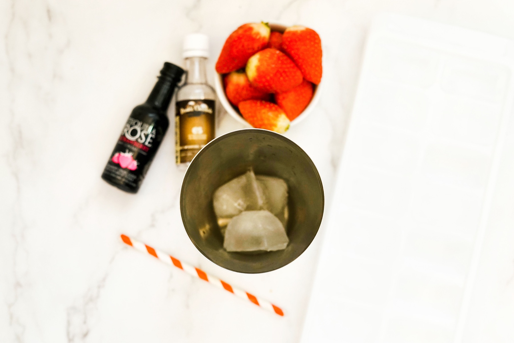 place ice in a cocktail shaker