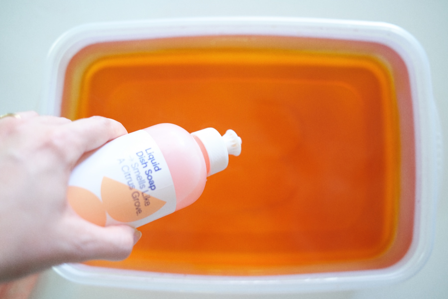 add a drop of dish soap to the fabric dye bath