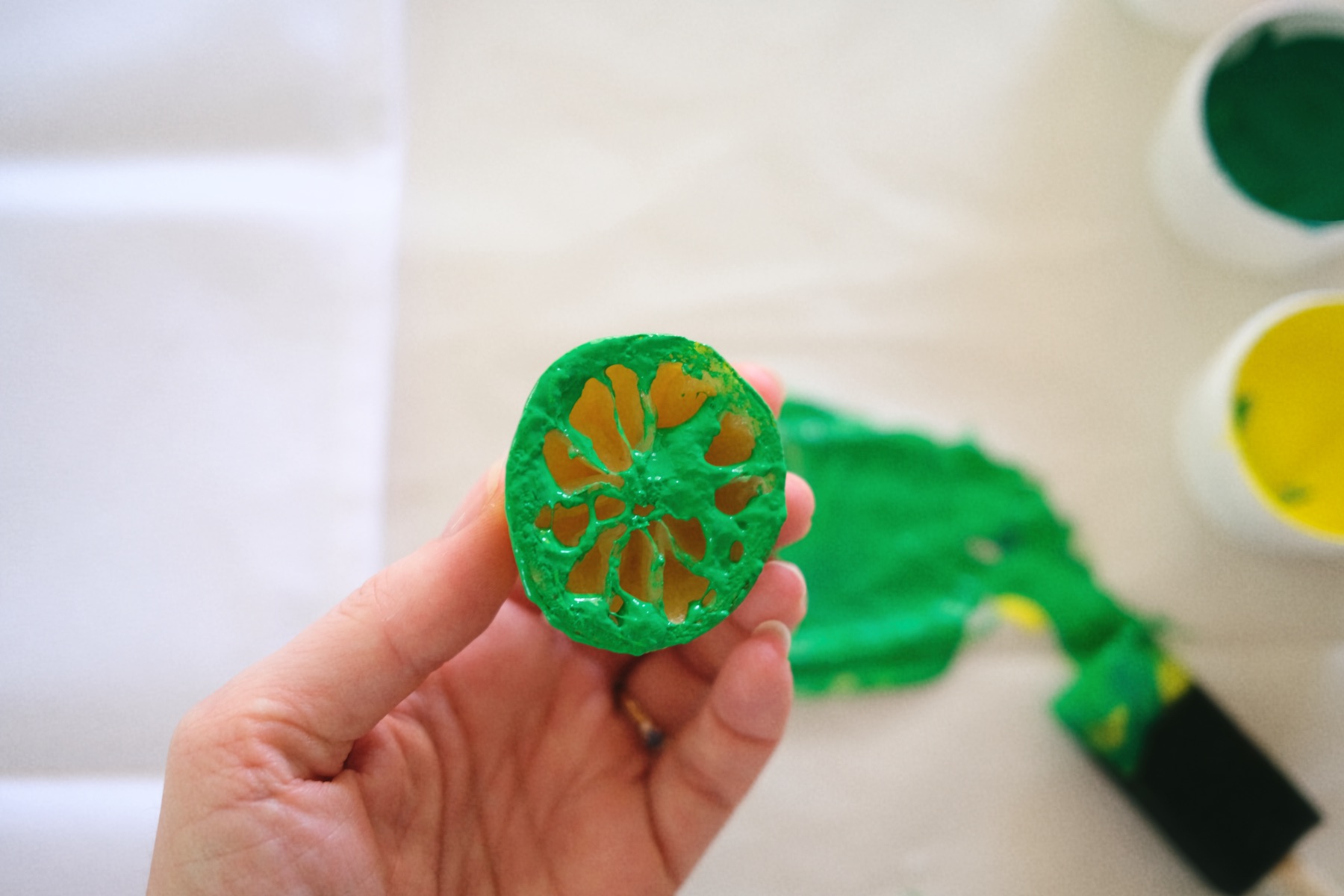 press the stamp into the fabric paint