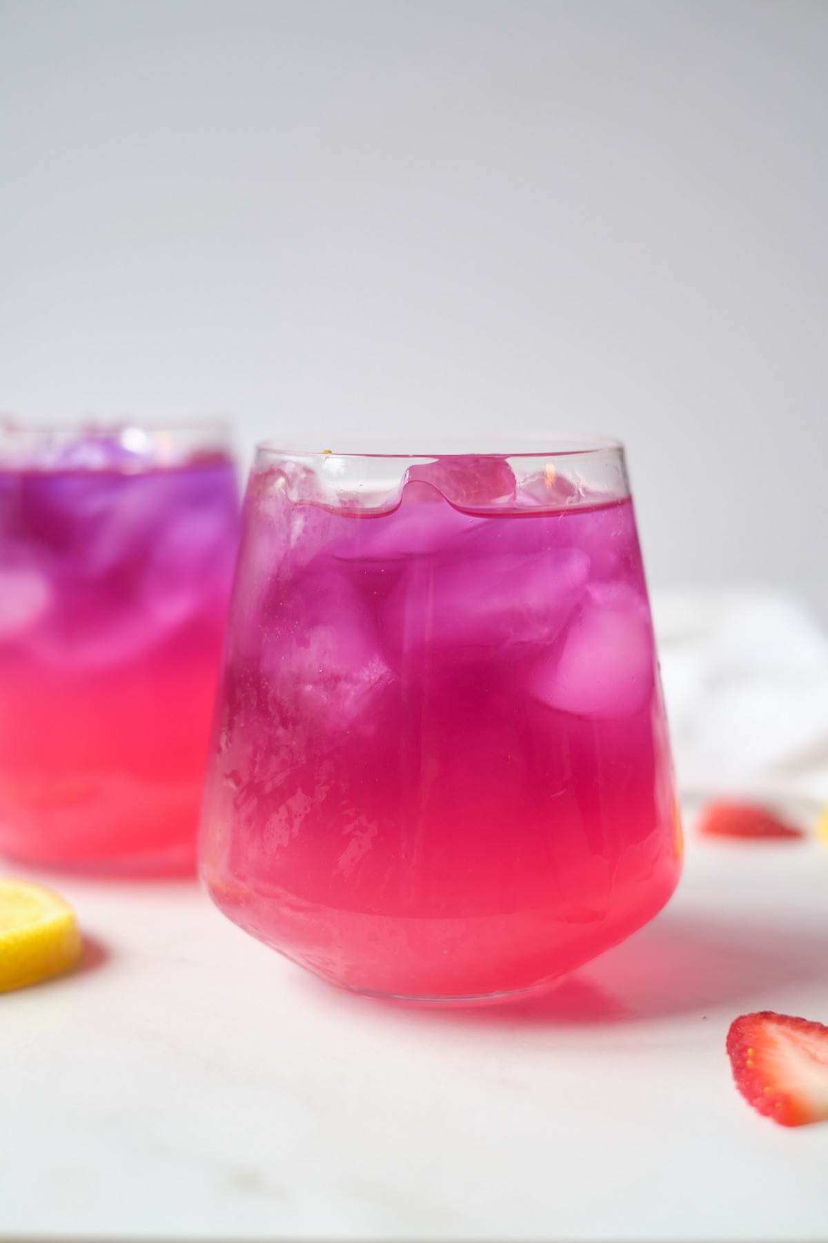 close up of finished layered lemonade with butterfly pea flower