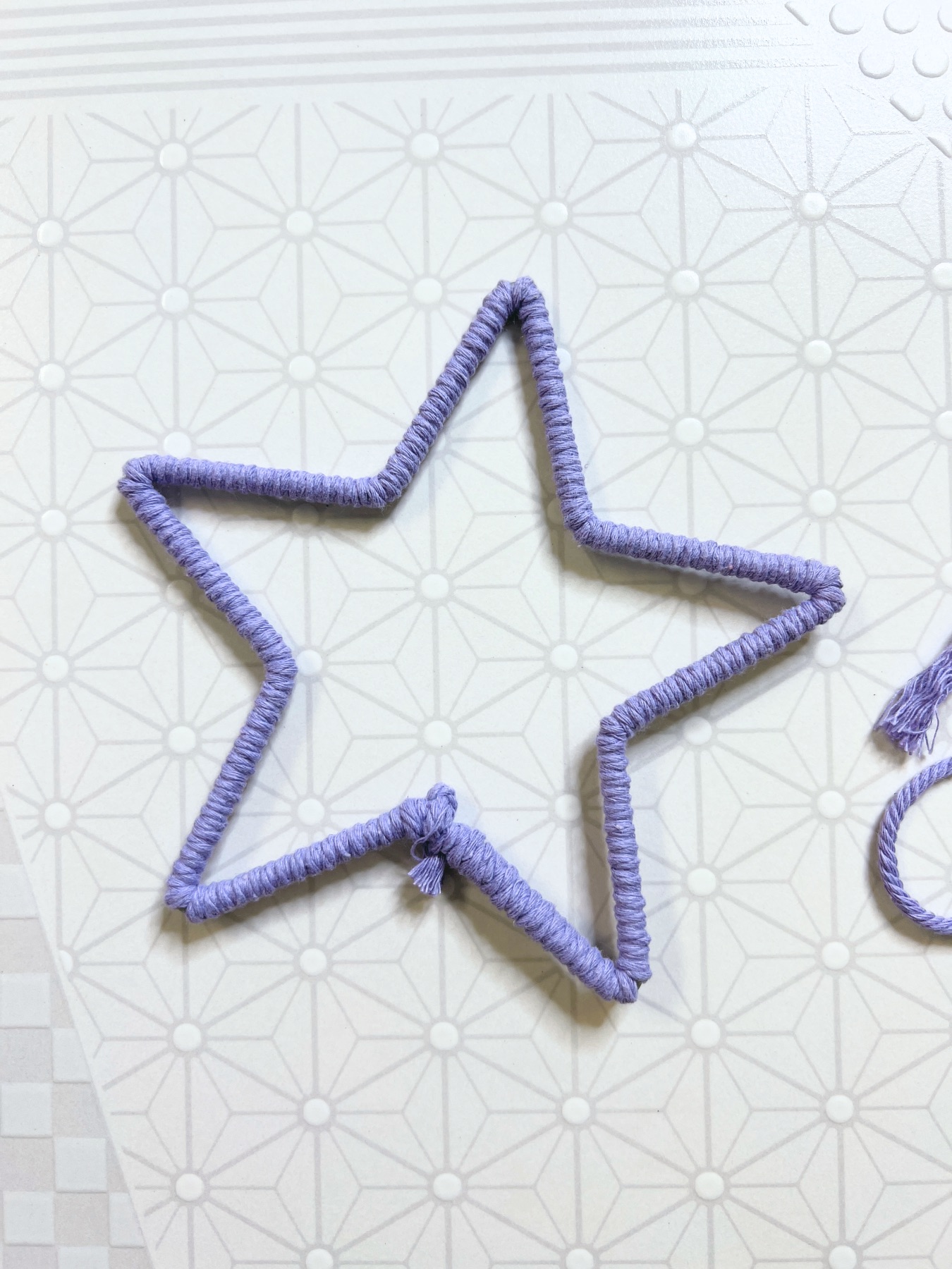 cut the extra cord on the star macrame base