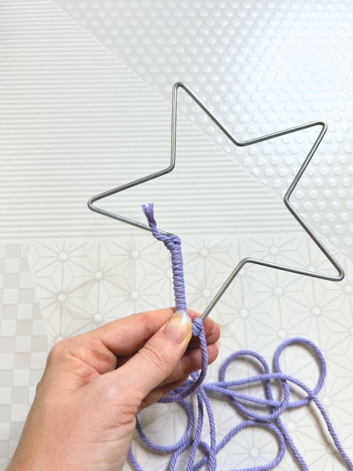 wind the macrame cord around the star base