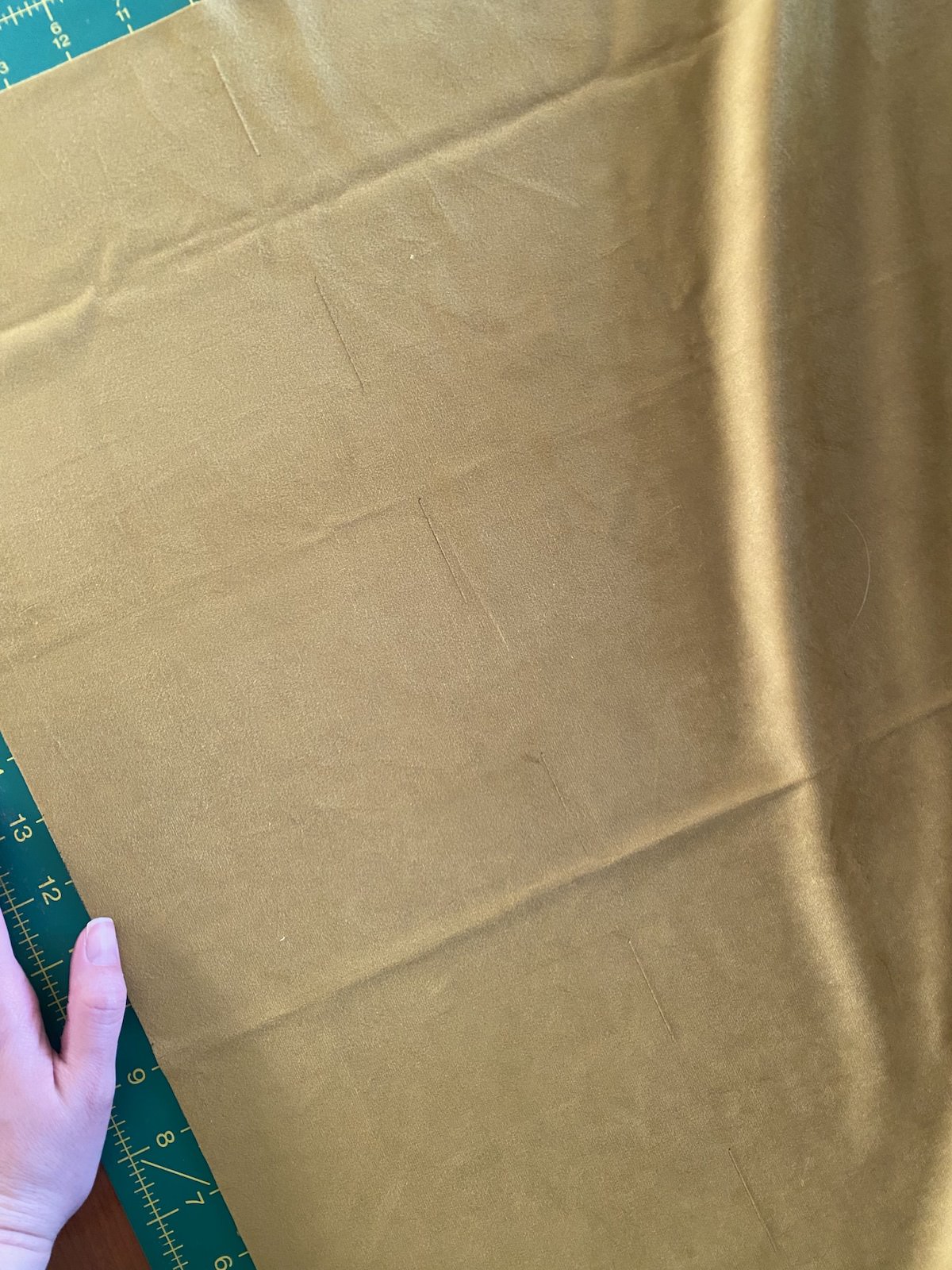 cutting marks on a chartreuse piece of velvet