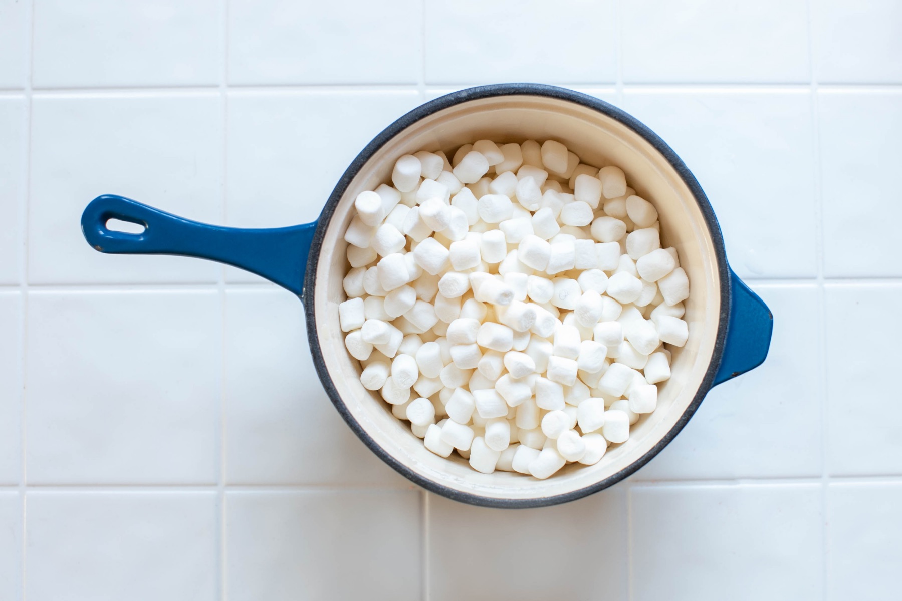 add marshmallows to the melted butter