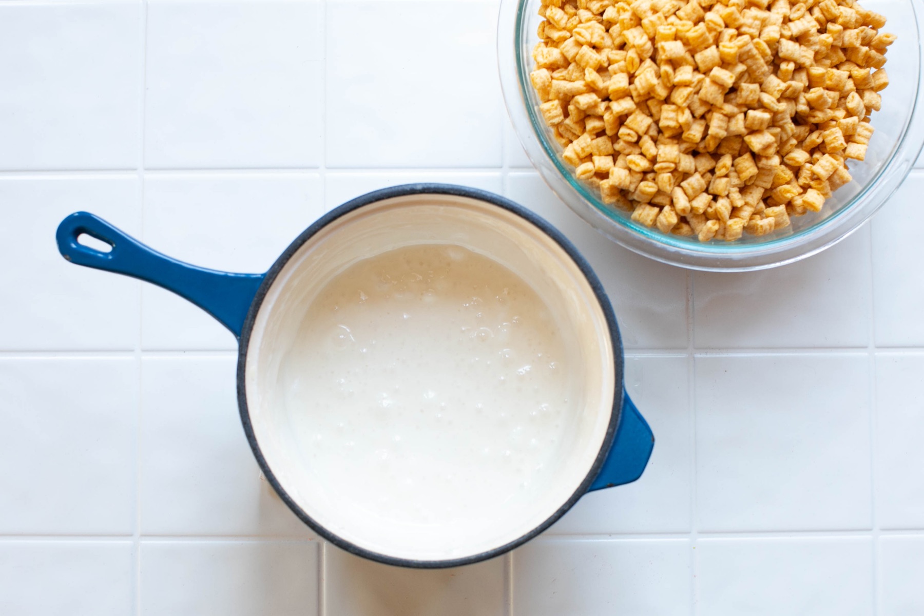 add the cereal to the melted marshmallow
