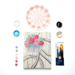 supplies inside a bicycle with basket of flowers painting kit