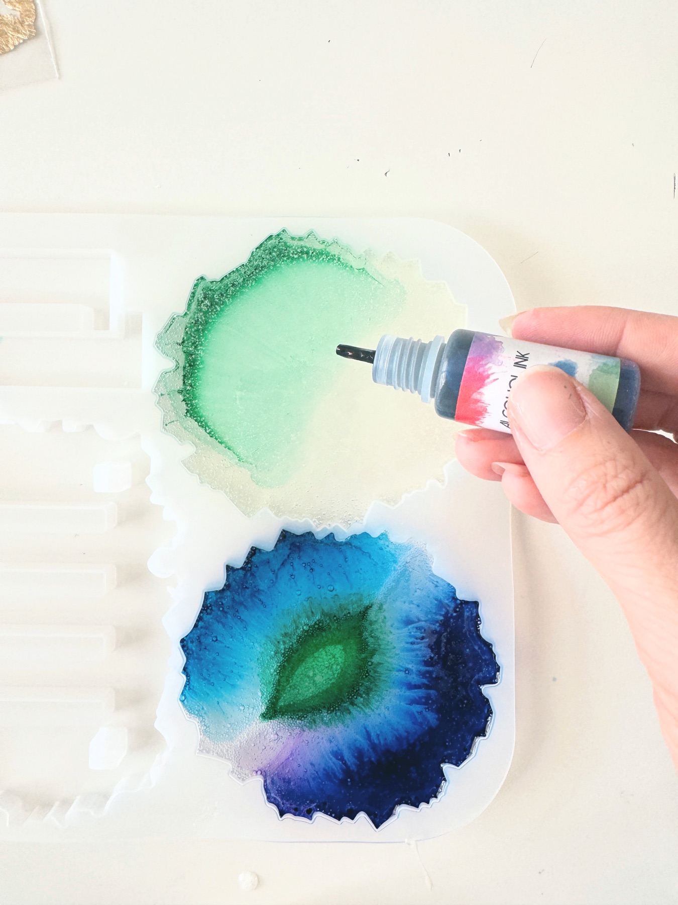add alcohol ink before and after the resin in mold