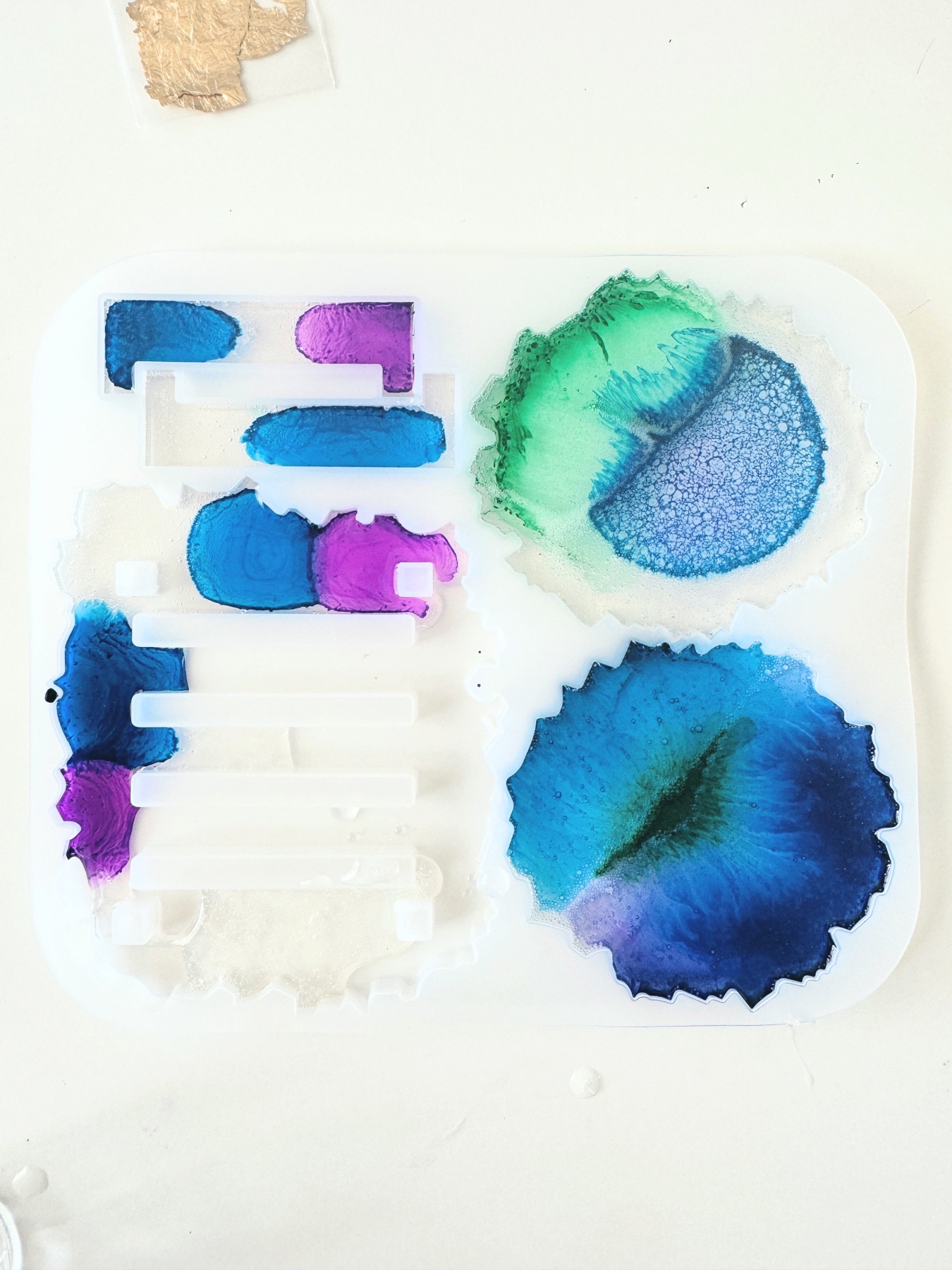 coaster resin mold filled with resin and alcohol ink