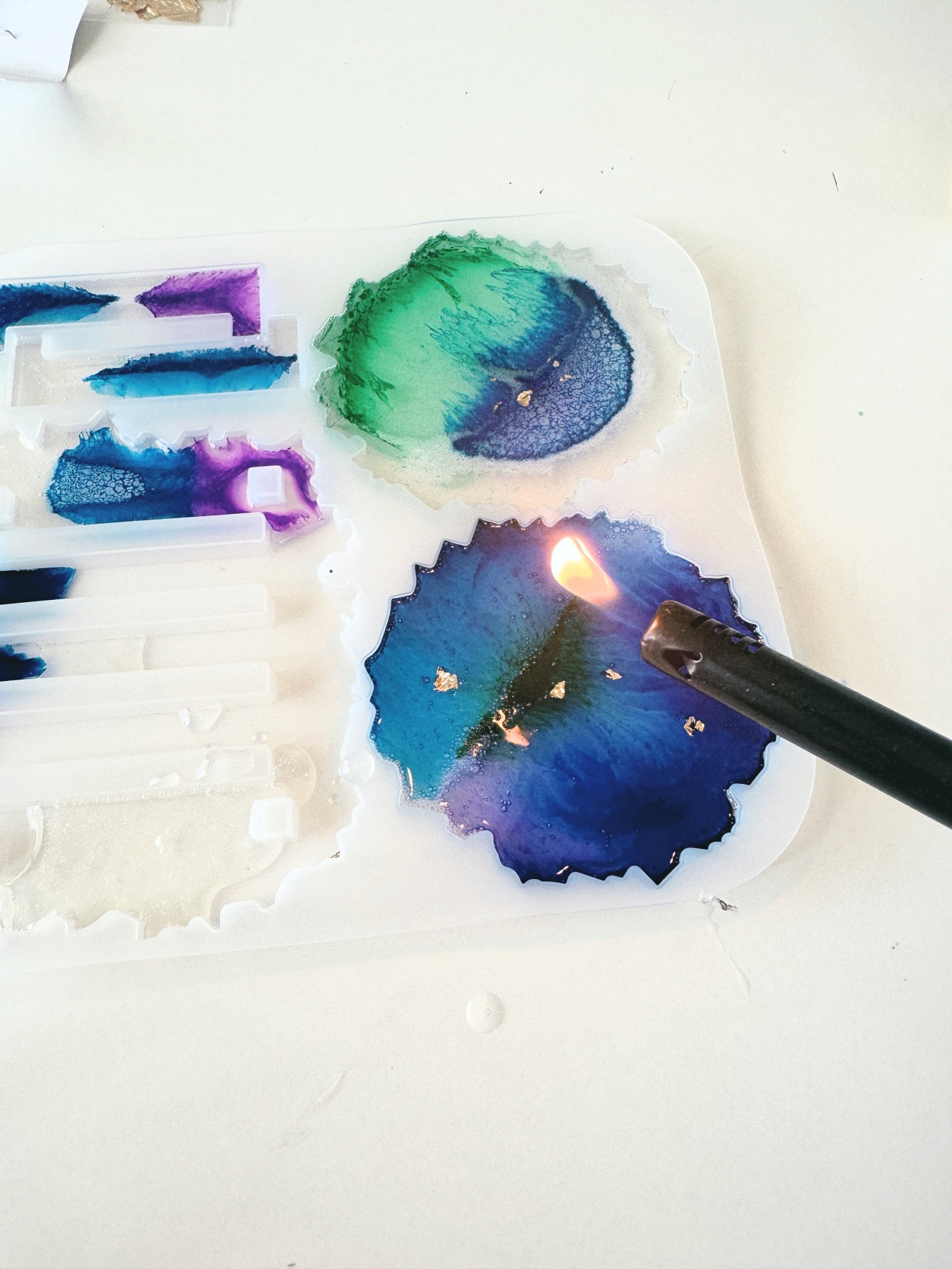 how to remove air bubbles in resin with a flame