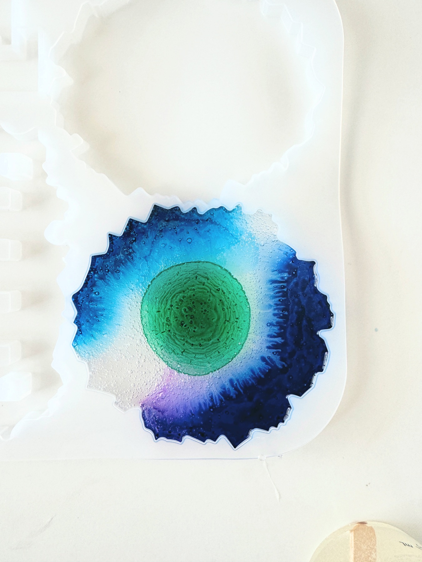 pour resin into the mold and add more alcohol ink