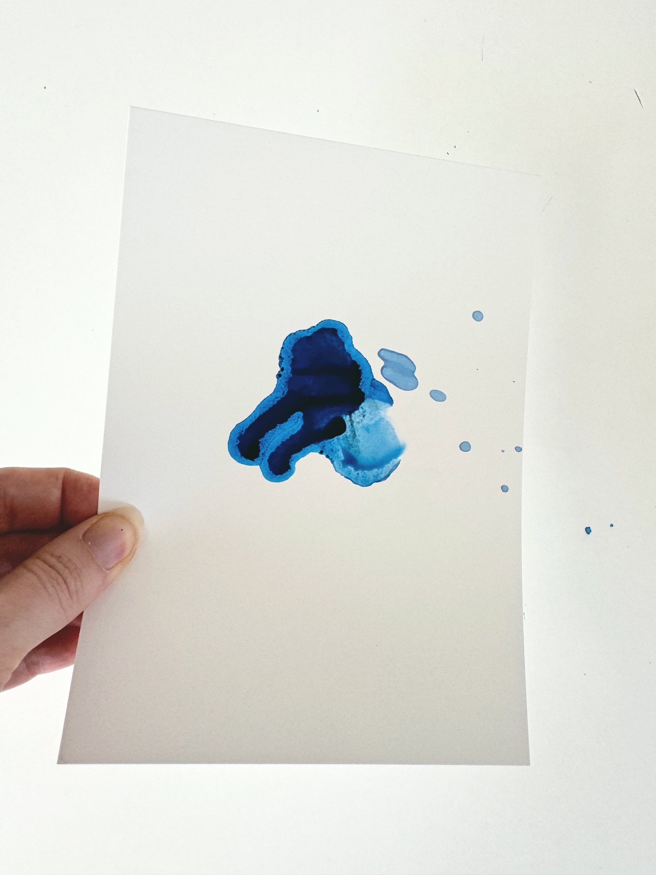 tilt the paper to move the alcohol inks