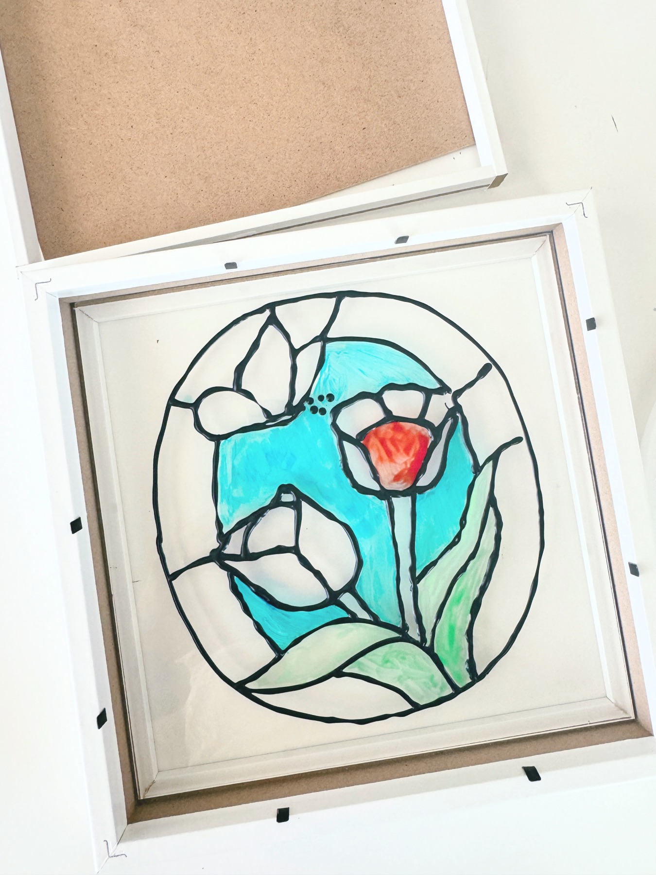 place the stained glass inside the frame web