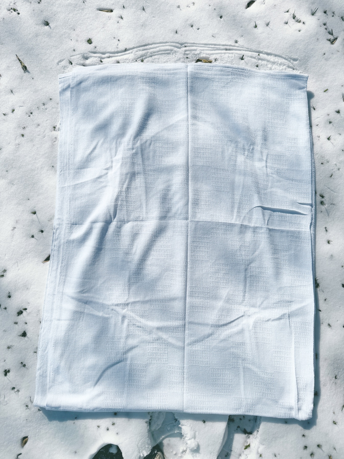 cotton blanket in the snow before dyeing web