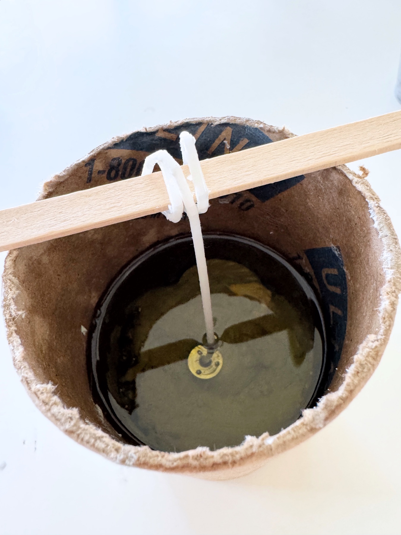 pour wax into the concrete candle mold web