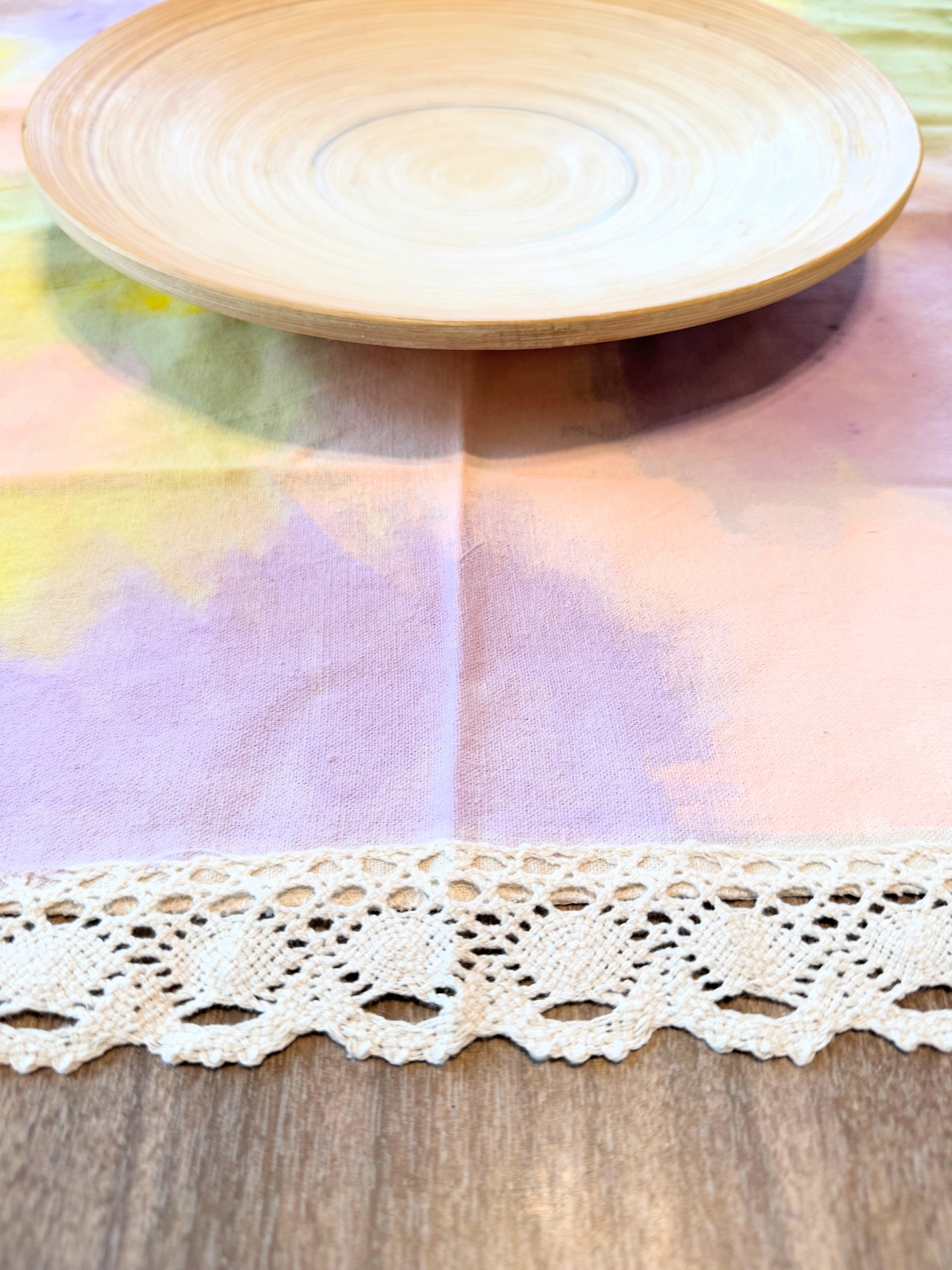 close up detail of diy watercolor fabric paint tablecloth web