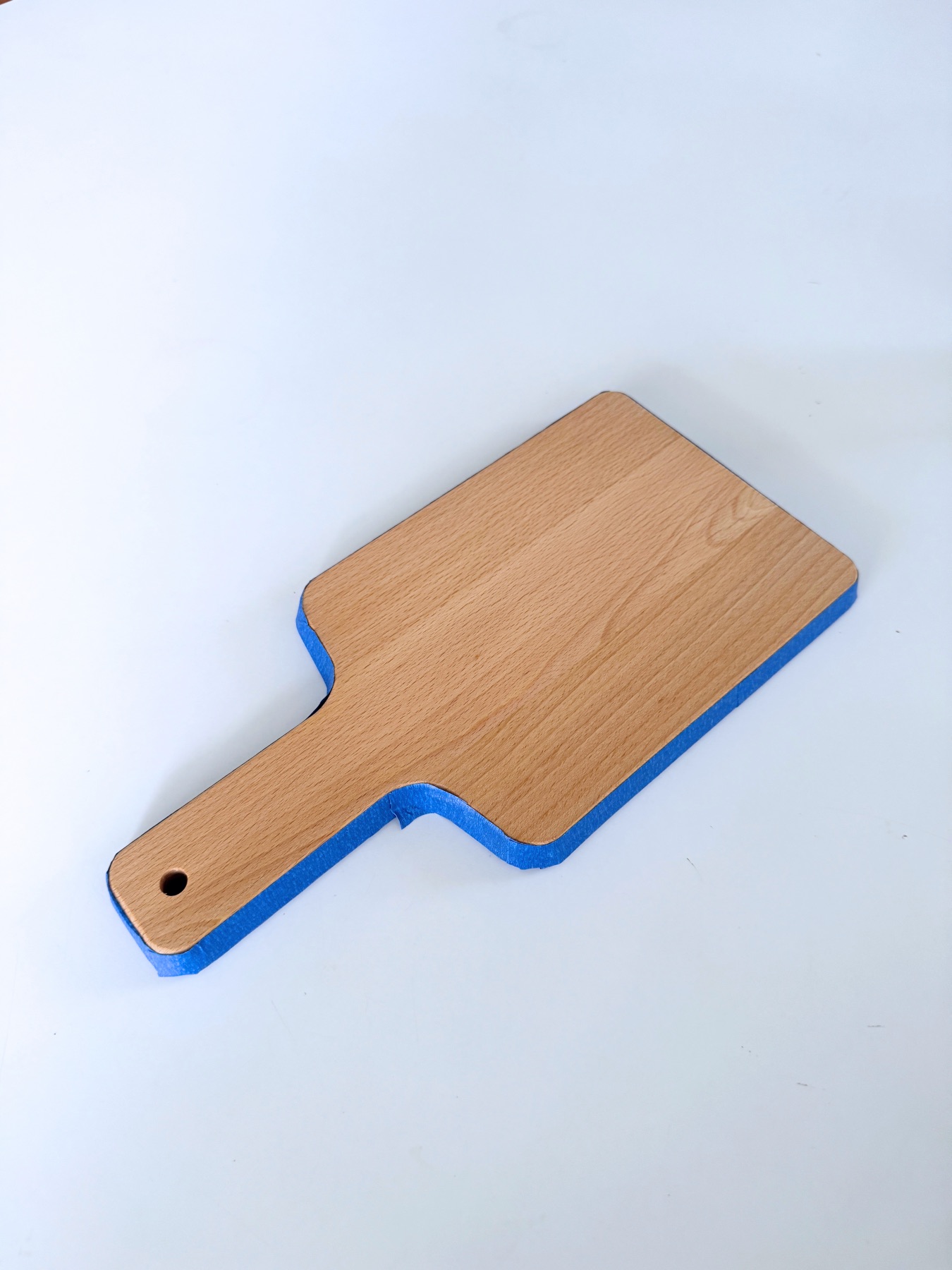all sides of the board coated with tape web