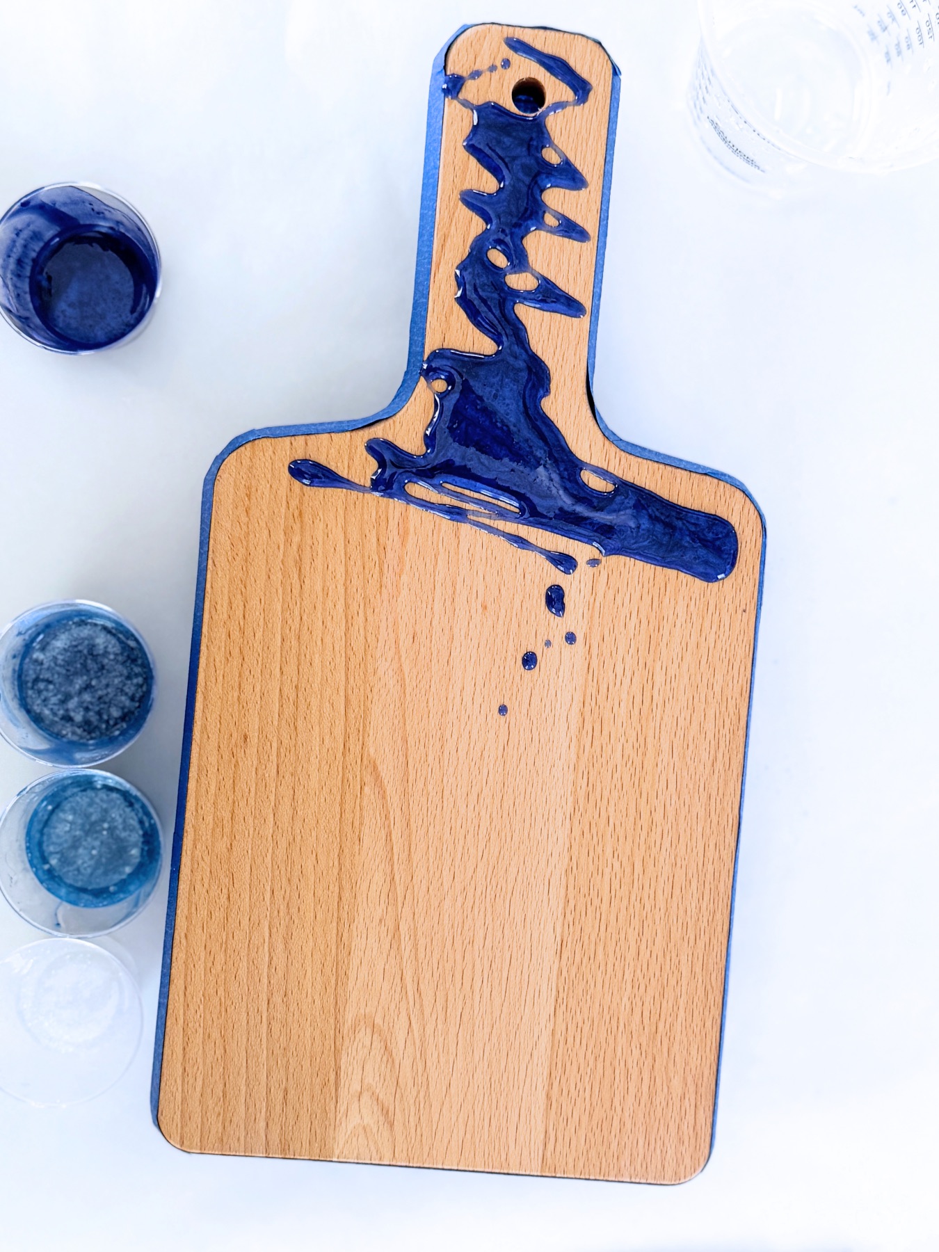 pour resin over the board in layers web