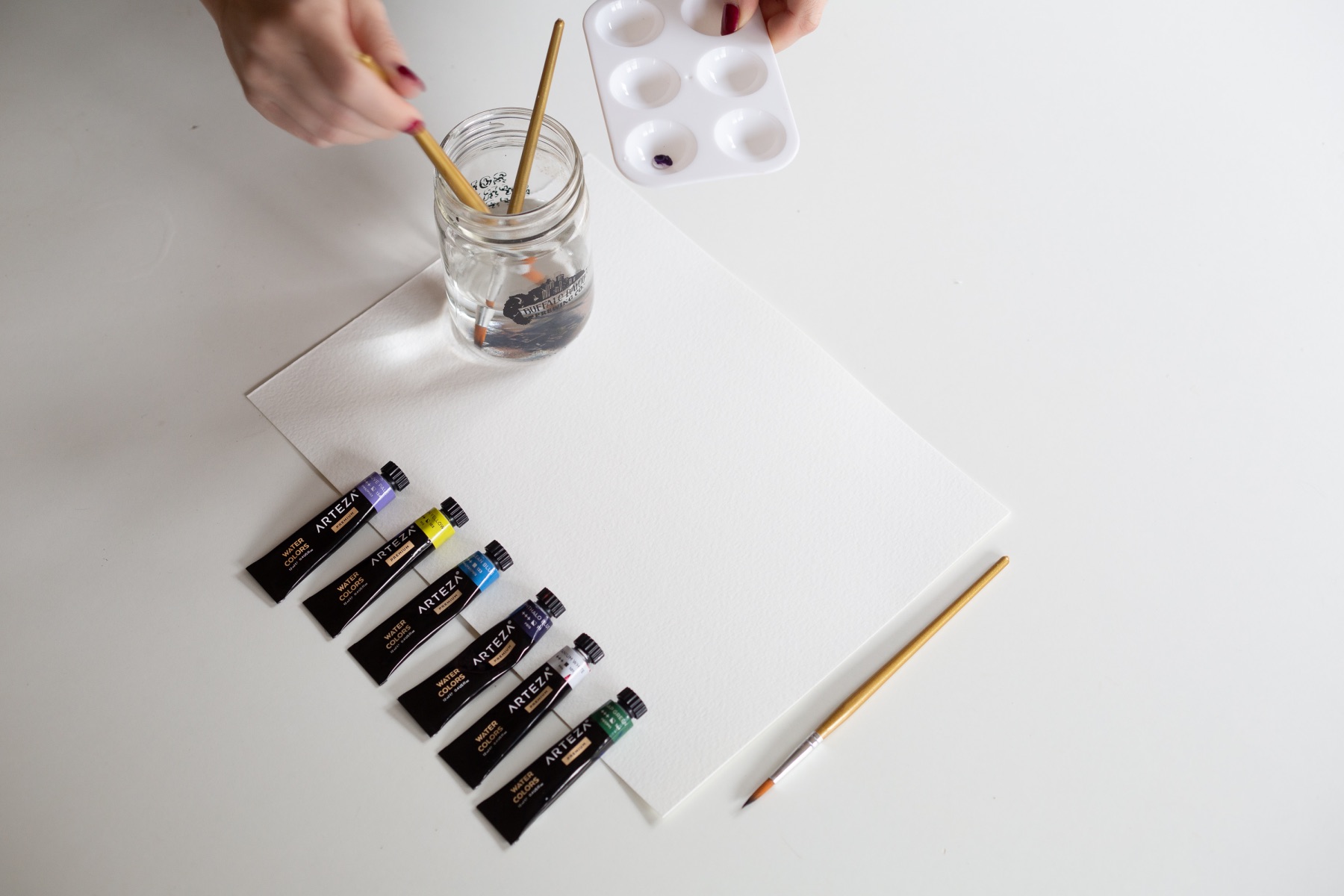 adding water to the watercolor pigment