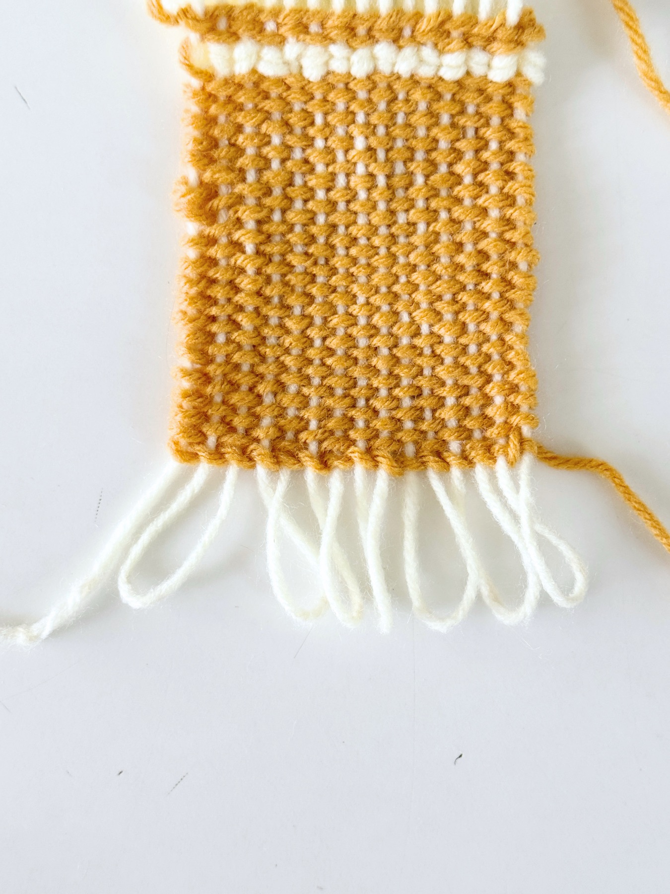 remove the coaster from the loom web