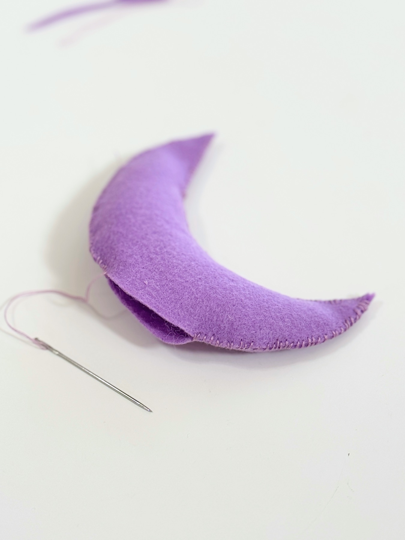 finish sewing the crescent moon web
