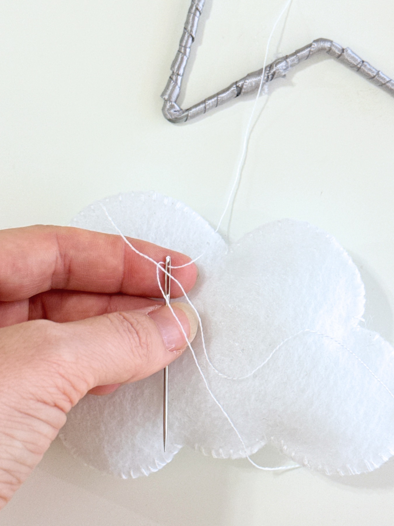 pull one side of the string through web